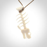 Hand carved bone fish skeleton pendant. Hand made bone fish necklace. Fish themed jewellery. Ocean themed pendant. One only necklace provided with adjustable cord and free delivery.
