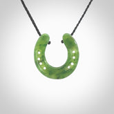 This is a beautiful horseshoe pendant hand carved in British Columbian jade. Hand carved for all the horse lovers out there. Free postage worldwide. Jade horseshoe jewellery.