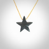 Hand carved black jade star pendant. Hand made black jade star pendant with adjustable cord.