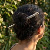 Woman wearing bone hair pin