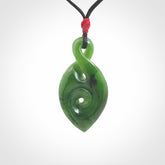 Ross Crump twist with koru pendant. Hand carved from rare New Zealand jade this is a beautiful pounamu pendant. The cord is length adjustable. It has a little spiral floret at the top of the pendant.