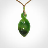 Ross Crump twist with koru pendant. Hand carved from rare New Zealand jade this is a beautiful pounamu pendant. The cord is length adjustable.