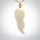 A hand carved large bone double fern leaf necklace. A beautiful large double fern leaf pendant carved from bone for NZ Pacific. This is a true piece of wearable art and is provided with an adjustable cord.