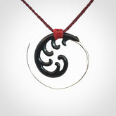 Hand carved pendant made from black jade with sterling silver. NZ Pacific contemporary Koru pendant for sale online.