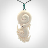 Hand carved bone swan pendant