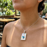 Woman wearing mother of pearl pendant