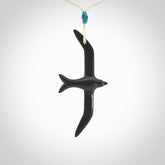 Hand carved black jade petrel bird pendant. Made by NZ Pacific, unique jewellery for sale online. Black Jade petrel bird necklaces with adjustable cords. Delivered with express courier and packaged in a woven kete pouch.