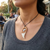 Woman wearing bone pendant