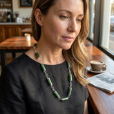 Woman wearing jade and silver necklace