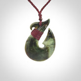 Hand carved New Zealand Jade Hook Pendant. Matau necklace hand carved. Jade Hook pendant provided with adjustable cord and packaged in a woven kete pouch. Delivered with Express Courier.