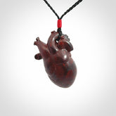 This pendant is handcrafted from Red Jasper Stone. It replicates a human heart. It is supplied with an adjustable black cord.