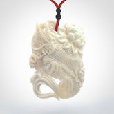 Hand Carved Bone dragon hatchling pendant