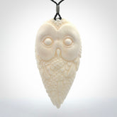 A Owl design carving, hand made for us from Bone. This pendant is provided with an adjustable black cord.