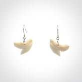 Hand carved small sized Tiger shark tooth earrings. Hand made shark tooth earrings. Real shark tooth art to wear. Free Shipping worldwide. Packaged in a woven kete pouch.
