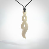 A handcarved masterpiece. A complex twist pendant carved from bone by Yuri Terenyi for NZ Pacific. This is a true piece of wearable art which is collectible.