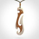 Hand carved bone hook pendant