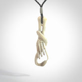 Hand carved deer antler skeleton hand with snake pendant. Hand carved by NZ Pacific. Free postage worldwide. Hand made skeleton hand with snake necklace from deer antler. Skeleton hand with snake necklace for men and women.