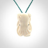 This is a beautiful little hand carved octopus pendant. It is a very cute little pendant that we have carved in natural, untreated bone. We provide these with adjustable cords and shipping is included worldwide.