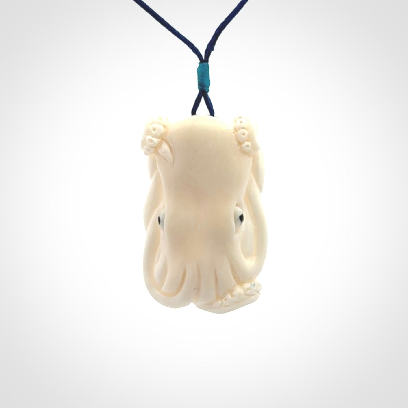 This is a beautiful little hand carved octopus pendant. It is a very cute little pendant that we have carved in natural, untreated bone. We provide these with adjustable cords and shipping is included worldwide.