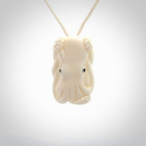 This is a beautiful little hand carved octopus pendant. It is a very cute little pendant that we have carved in natural, untreated bone. We provide these with meringue adjustable cords and shipping is included worldwide.