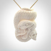 Hand carved bone snake skull pendant. Hand carved by NZ Pacific. Free postage worldwide. Hand made snake with skull necklace from bone. Snake skull necklace for men and women.