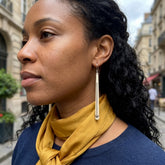 Woman wearing bone earrings