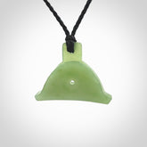 Hand carved New Zealand jade dog whistle. Carved for NZ Pacific by master carver Ross Crump. Jade dog whistle pendant provided with adjustable cord and delivered with express courier.
