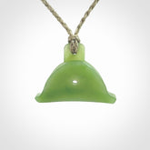 Hand carved New Zealand jade dog whistle. Carved for NZ Pacific by master carver Ross Crump. Jade dog whistle pendant provided with adjustable cord and delivered with express courier.