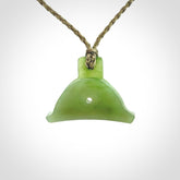 Hand carved New Zealand jade dog whistle. Carved for NZ Pacific by master carver Ross Crump. Jade dog whistle pendant provided with adjustable cord and delivered with express courier.