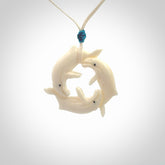 Hand carved natural bone whale trilogy pendant. Art to wear. Ocean themed pendants.