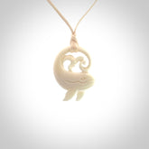 A hand carved bone whale pendant. This is a lovely piece carved to bring pleasure to the lucky wearer. It is a friendly pendant which we will ship to you free wherever you live. Carved by NZ Pacific and for sale online. Provided with an adjustable cord.