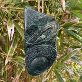 This is a large hand carved New Zealand Jade wheku pendant. It is made from New Zealand Jade and Paua shell.