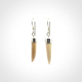 Hand made mammoth tusk drop earrings. Made by NZ Pacific - handmade jewellery for sale online. Woolly Mammoth Tusk fang style earrings, packaged in a woven kete pouch.