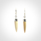 Hand made mammoth tusk drop earrings. Made by NZ Pacific - handmade jewellery for sale online. Woolly Mammoth Tusk fang style earrings, packaged in a woven kete pouch.