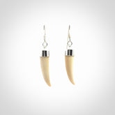 Hand made mammoth tusk drop earrings. Made by NZ Pacific - handmade jewellery for sale online. Woolly Mammoth Tusk fang style earrings, packaged in a woven kete pouch.