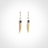 Hand made mammoth tusk drop earrings. Made by NZ Pacific - handmade jewellery for sale online. Woolly Mammoth Tusk fang style earrings, packaged in a woven kete pouch.