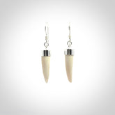 Hand made mammoth tusk drop earrings. Made by NZ Pacific - handmade jewellery for sale online. Woolly Mammoth Tusk fang style earrings, packaged in a woven kete pouch.