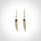 Hand made mammoth tusk drop earrings. Made by NZ Pacific - handmade jewellery for sale online. Woolly Mammoth Tusk fang style earrings, packaged in a woven kete pouch.