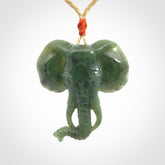 This is a hand made elephant pendant. Carved in a beautiful darker green piece of British Columbian jade. The cord is hand-plaited in a oat colour and is length adjustable. Provided in a woven kete pouch and delivered with express courier.