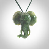 This is a hand made elephant pendant. Carved in a beautiful darker green piece of Aceh jade. The cord is hand-plaited in an green colour and is length adjustable. Provided in a woven kete pouch and delivered with express courier.