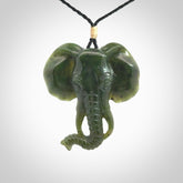 This is a hand made elephant pendant. Carved in a beautiful darker green piece of British Columbian jade. The cord is hand-plaited in a black colour and is length adjustable. Provided in a woven kete pouch and delivered with express courier.