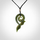 An absolutely stunning jade whale tail pendant