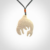 Hand carved woolly mammoth tusk Aztec pendant