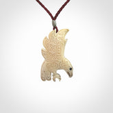Hand Carved Woolly Mammoth Tusk bird pendant