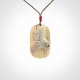 A wonderful pendant, carved in mammoth tusk
