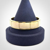 This piece is a hand made bracelet. It is made from selected pieces of woolly mammoth tusk which we have cut and polished and then inset into a brass bracelet. It is a very striking piece one of a kind and truly beautiful.