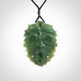 This picture shows a large hand carved forest man face pendant. The cord is hand plaited and adjustable.