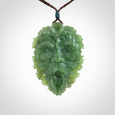This picture shows a large hand carved forest man face pendant. The cord is hand plaited and adjustable.