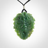 This picture shows a large hand carved forest man face pendant. The cord is hand plaited and adjustable.