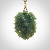 This picture shows a large hand carved forest man face pendant. The cord is hand plaited and adjustable.